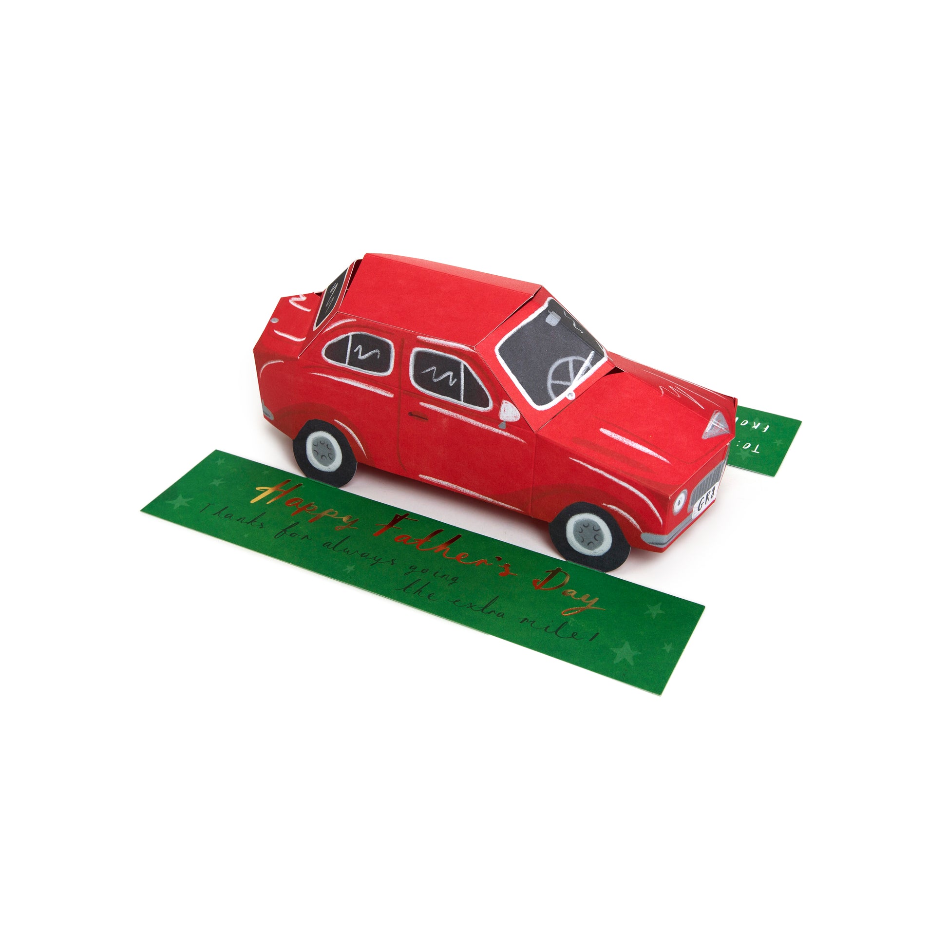 A red vintage-style car pop-up card with a green 'Happy Father's Day' message card underneath, shown on a plain white background.