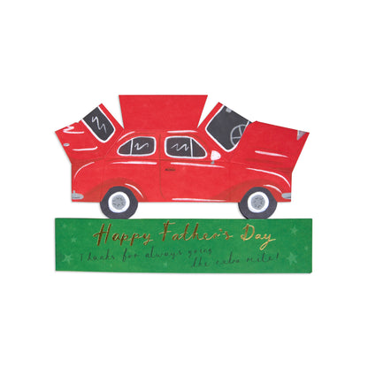 A decorative Father's Day card featuring a red vintage car with open trunk and hood, above a green banner that reads 'Happy Father's Day thanks for always giving the extra mile!' on a plain white background.