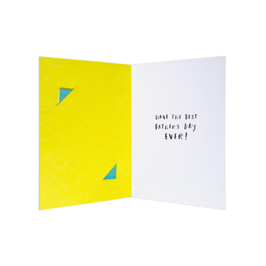 An open greeting card on a white background, showing a bright yellow left panel with two small blue triangle cutouts and a white right panel with the handwritten message 'HAVE THE BEST FATHER'S DAY EVER!'.