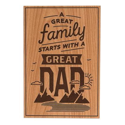 Hallmark Father's Day Card - Traditional "Great Family" featuring a wood texture background with bold typography and scenic elements.