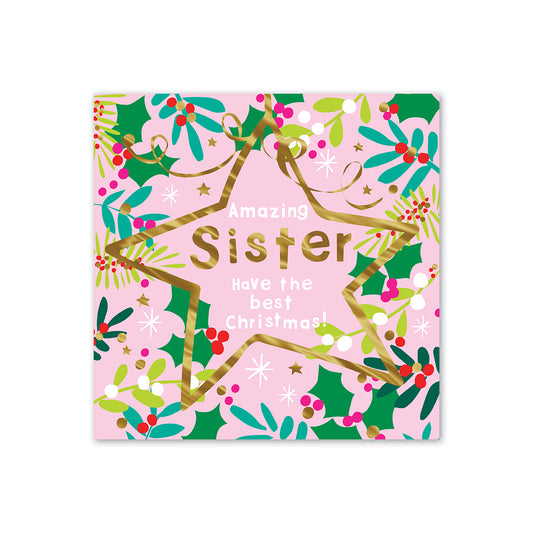 Hallmark Christmas card for sister - Amazing Wish with colourful holly and star illustrations, gold foil text on pink background.