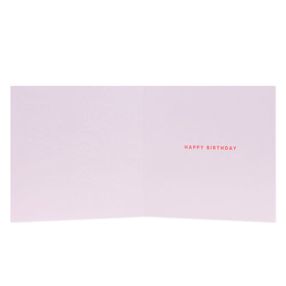 Hallmark Floral Birthday Card inside view with embossed design and bright red 'Happy Birthday' text on pale pink background.