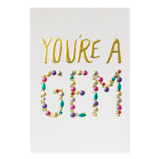 Hallmark Signature Greeting Card - You're A Gem with embossed gold foil lettering and colourful gems on a white background.
