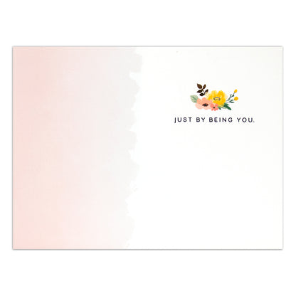 Hallmark Signature Greeting Card - You Make The World Better featuring a pastel pink design, floral illustrations, and the message 'Just by being you.'