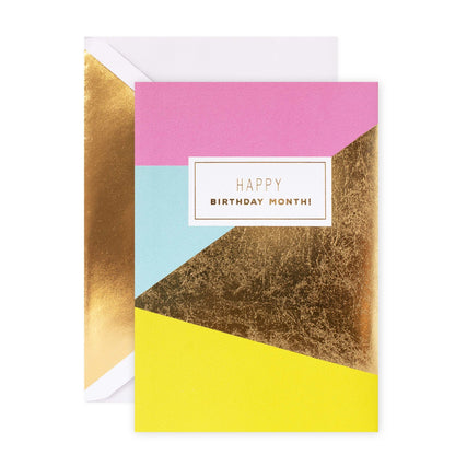 Hallmark Signature Birthday Card - One Day Isn't Enough featuring colourful geometric shapes and gold foil highlights in a flat lay design.