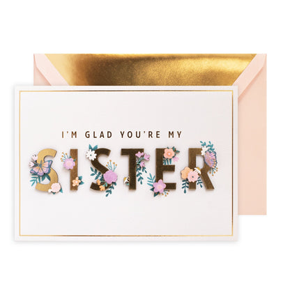 Hallmark Signature Greeting Card - Celebrate You (For Sister) featuring embossed floral elements and a gold foil-lined envelope.