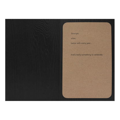 Hallmark Signature Birthday Card - Stronger, Wiser, Better Every Year, kraft paper overlay with embossed message, flat lay view
