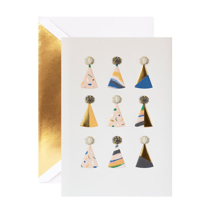 Hallmark Signature Birthday Card - Party Hats featuring colourful patterned hats and gold foil highlights, flat lay view.