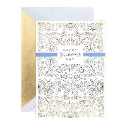 Hallmark Signature Wedding Congratulations Card - Surrounded By Love with gold foil, floral design and blue ribbon detail, flat lay angle