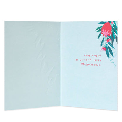 Hallmark Christmas card - Wishes From Australia, inside view featuring floral illustrations and festive message in pink text