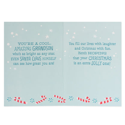 Hallmark Christmas Card For Grandson - Extra Jolly, open view, with blue background, candy canes, and festive messages inside.