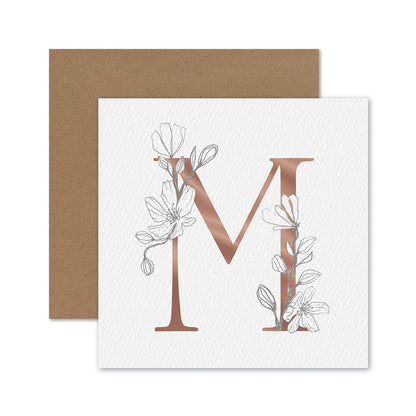 Hallmark Mother's Day Card - M for Mum featuring a gold foiled capital M design with floral elements, paired with a kraft envelope.
