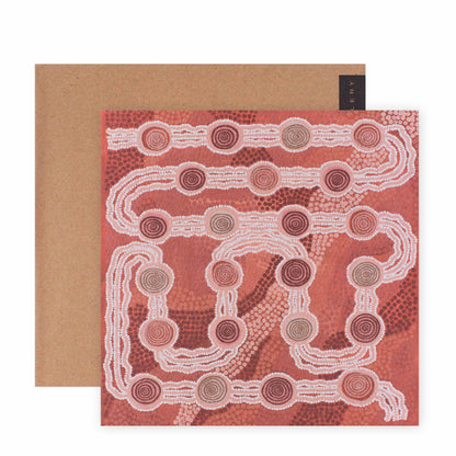Hallmark x Emma Stenhouse Gallery Blank Greeting Card - Journey Through The Dessert, featuring intricate Indigenous artwork in warm tones, angled view with kraft envelope.