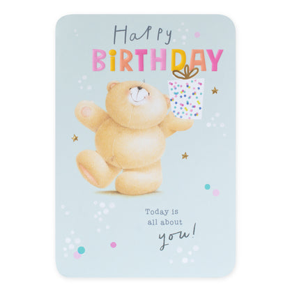Hallmark Forever Friends Birthday Card - All About You featuring a bear holding a gift, with colourful dots and stars on a light blue background.