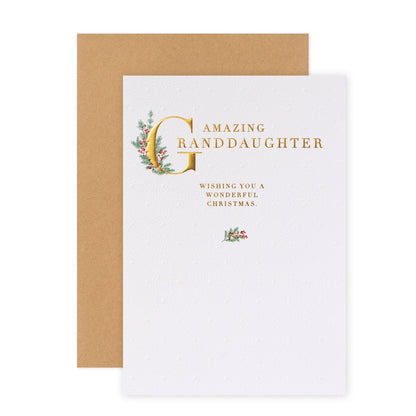 Hallmark Christmas Card For Granddaughter - With Love, embossed gold foil lettering, illustrations of holly, flat lay view.