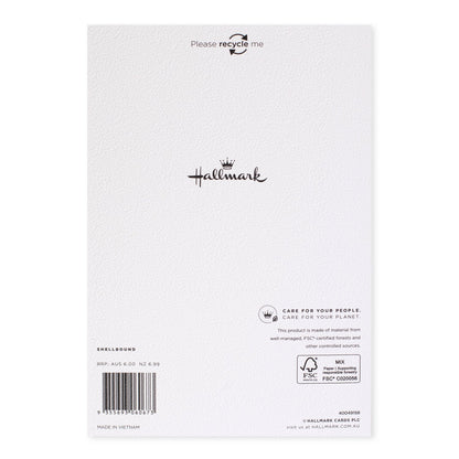 Hallmark Christmas card for granddaughter - With Love back view, featuring care instructions and logo details on textured paper.