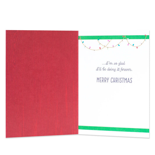 Hallmark Christmas card for husband - Love You Is Fun, open view showcasing red interior and festive illustrations with colourful Christmas lights.