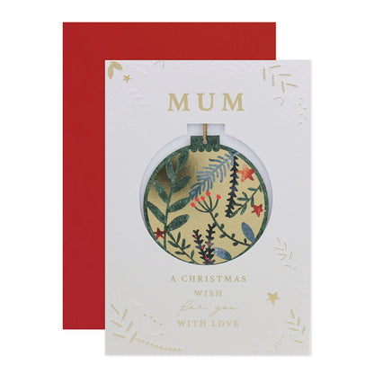 Hallmark Christmas card for Mum with detachable ornament, featuring floral designs and gold foil accents, flat lay on white background.