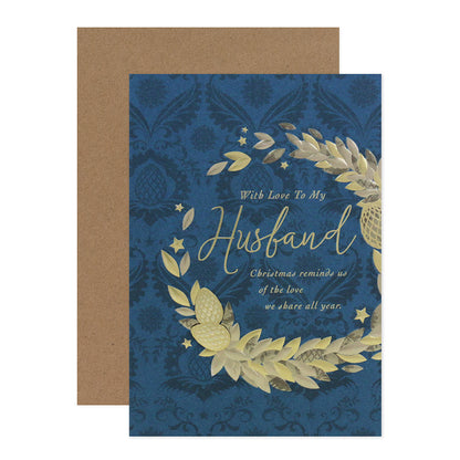 Hallmark Christmas card for husband - The Love We Share featuring embossed wreath design on blue baroque background.
