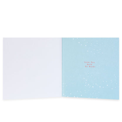Hallmark Christmas card for Mum & Dad - Love You Both, interior view showing blue background with snowflakes and the message 'Love You Both So Much'.