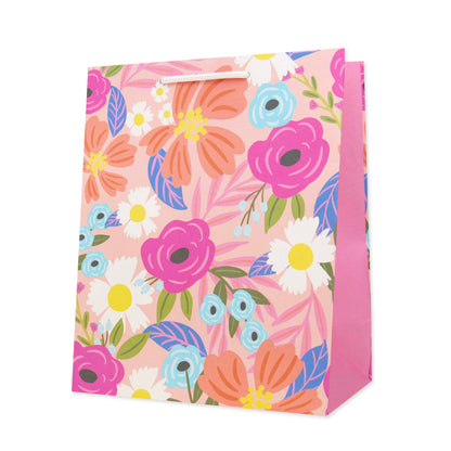 Hallmark Medium Gift Bag - Christie Williams Floral featuring a vibrant floral design with pink accents, angled view showcasing the bag's detail.