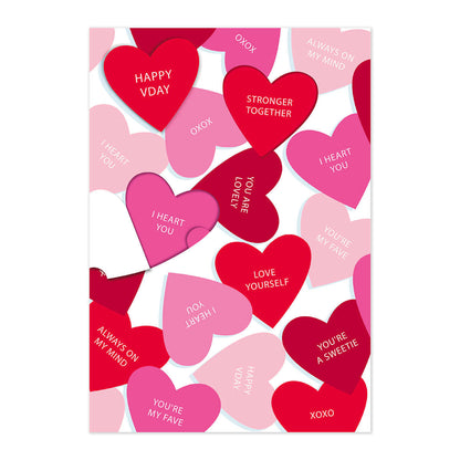 Hallmark Valentine's Day Card - Stronger Together, colourful card design featuring red and pink hearts with hidden messages, flat lay view.