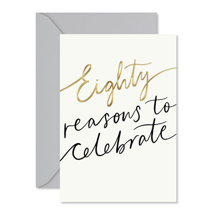 Hallmark 80th birthday card - Reasons To Celebrate featuring embossed details and gold foil on the front with a grey envelope.