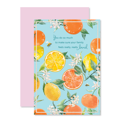 Hallmark Mother's Day Card - Really, Really Loved, vibrant design featuring colourful oranges and lemons, flat lay with pink envelope