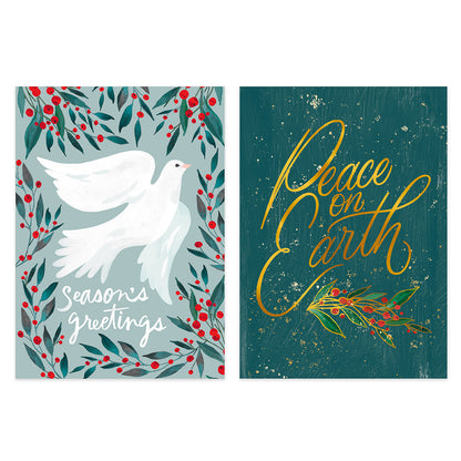 Two Christmas greeting cards shown side by side on a white background. The left card has a white dove surrounded by green leaves and red berries with the text 'seasons greetings.