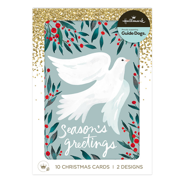 Hallmark Christmas Guide Dogs card set featuring a white dove illustration surrounded by red berries and green leaves on a muted blue-gray background, with gold glitter accents and a white border. Text at the bottom reads '10 Christmas Cards | 2 Designs'.
