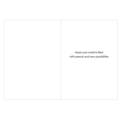 A minimalist white greeting card or art print with a thin vertical center line and the printed phrase, 'Hope your world is filled with peace and new possibilities.' in small black text on the right side.