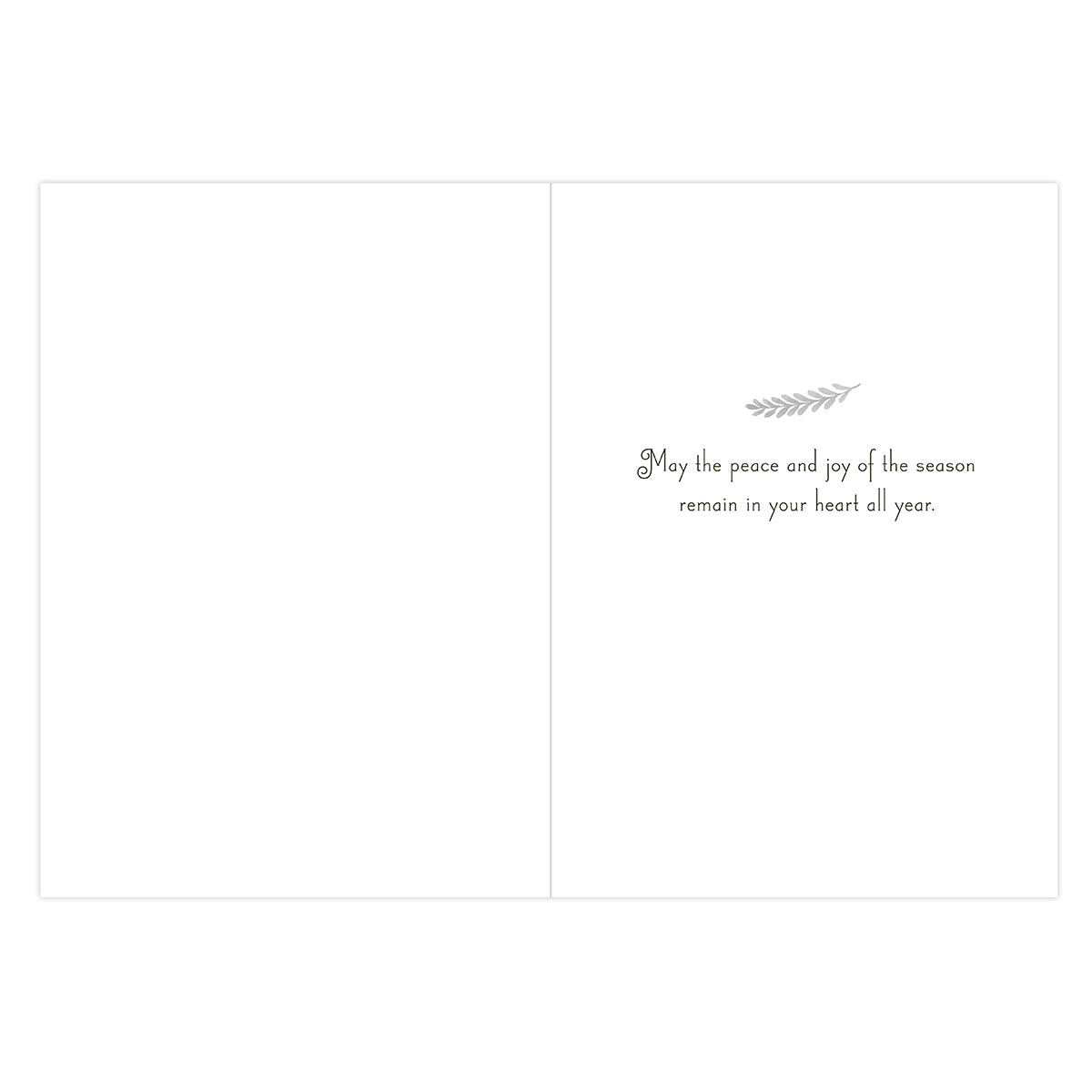 A blank greeting card shown from the back, with a small gray decorative sprig and the printed message, 'May the peace and joy of the season remain in your heart all year.' on a white background.