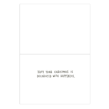 A minimalist white greeting card with a thin black border and the handwritten text 'HOPE YOUR CHRISTMAS IS DECORATED WITH HAPPINESS.' in the lower half.