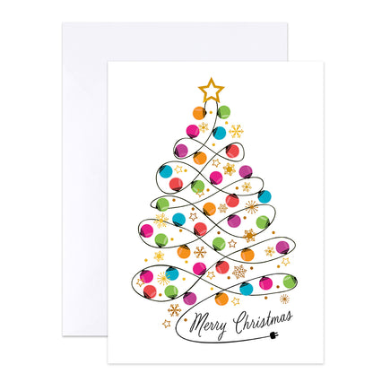 A white Christmas greeting card with a colorful spiral tree design made of ornaments, stars, and swirls, with the words 'Merry Christmas' in black script at the bottom. A plain white envelope is partially visible behind the card.