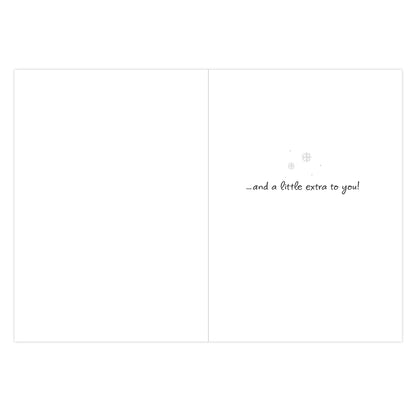 A blank greeting card or note with a folded center line and small handwritten text on the right side reading “.