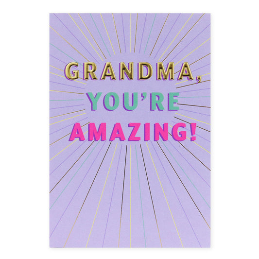 Hallmark Grandma Card - Grandma, you're amazing! features bright neon text on a lavender background with embossed gold foil details.
