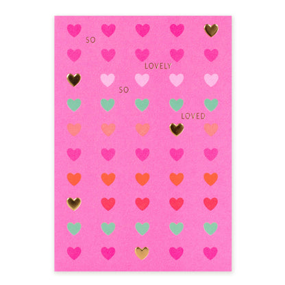Hallmark Blank Card - So lovely, so loved, bright pink with embossed hearts and gold foil detailing, flat lay view.
