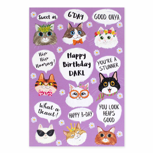 Hallmark Ozzy Oddities Birthday Card - Raining Cats featuring illustrated cats with birthday messages on a lavender background in a flat lay view.