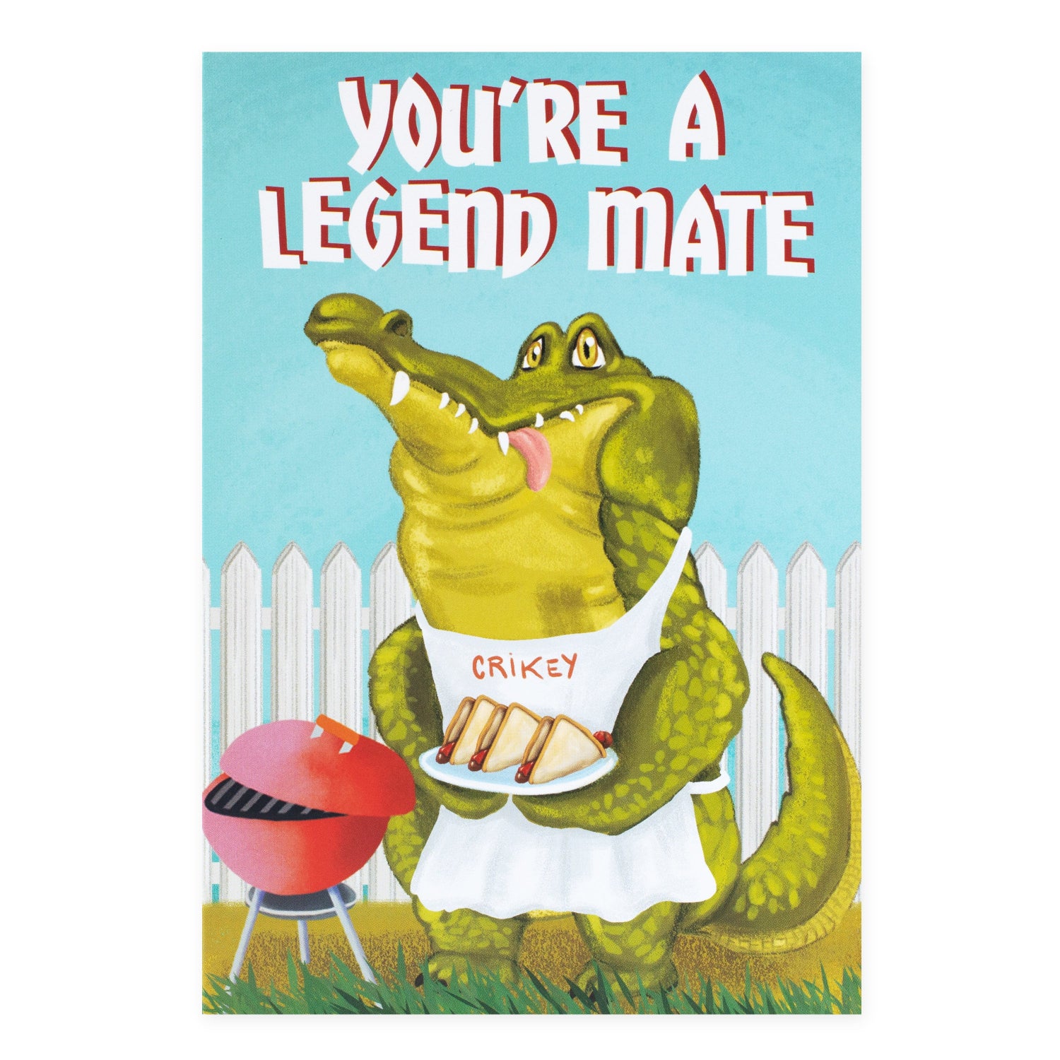 Hallmark Ozzy Oddities Greeting Card - Crikey Croc featuring a crocodile in an apron holding a plate, BBQ scene, colourful illustration.