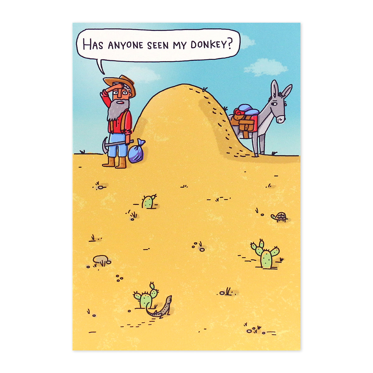 Hallmark Shoebox Birthday Card - Over The Hill featuring a cartoon man searching for his donkey behind a hill in a desert scene.