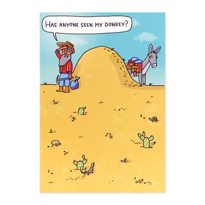 Hallmark Shoebox Birthday Card - Over The Hill featuring a cartoon man searching for his donkey behind a hill in a desert scene.