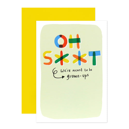 Hallmark Shoebox Birthday Card - Grown Ups, humorous design with colourful text, accompanied by a yellow envelope, flat lay