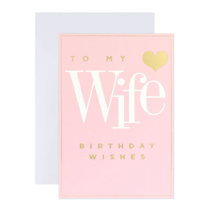 Connections from Hallmark Birthday Card For Wife - Woman I Love, pink card with gold foil text and heart, flat lay view.