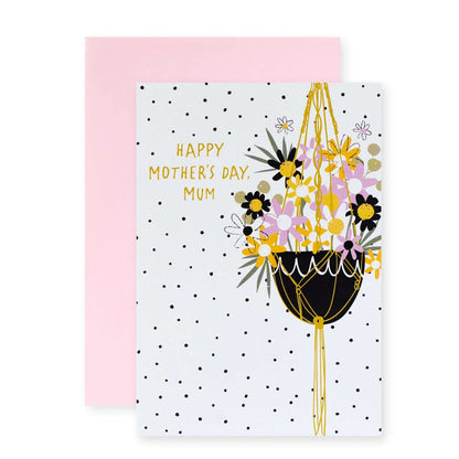 Hallmark Mother's Day Card - Happy Mother's Day Mum featuring a floral hanging basket design on a polka dot background, flat lay view.