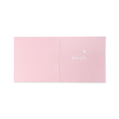 Hallmark Mother's Day Card - Floral open view, featuring a baby pink design with white floral details and the word 'lovely'.