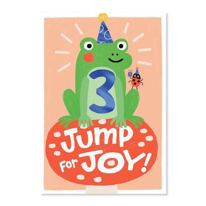 Connections from Hallmark Age 3 Birthday Card - Jump for Joy! features a cheerful frog wearing a party hat and blue foil number 3.