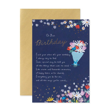 Hallmark Birthday Card - On Your Birthday featuring floral design, gold foil details, and cream envelope, flat lay view.