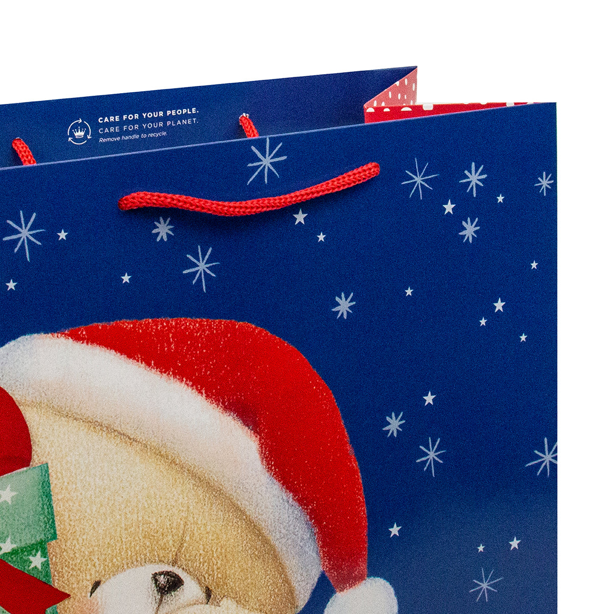 Hallmark Large Forever Friends Christmas Gift Bag - Christmas Bear with red cord handles and festive blue background featuring stars.