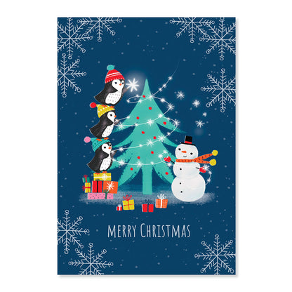 Creative Publishing by Hallmark Christmas Card - Penguins & Snowman with three penguins decorating a Christmas tree in the snow.
