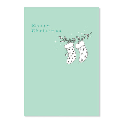 Creative Publishing by Hallmark Christmas Card - Stockings featuring illustrated stockings on a mint green background with a 'Merry Christmas' message.